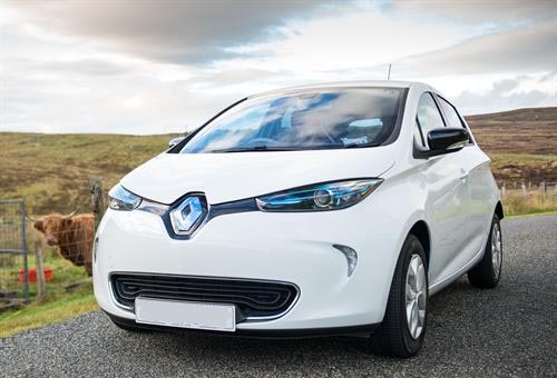 a white renault zoe on the road